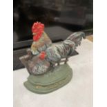 A CAST IRON HEN DOOR STOP