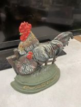 A CAST IRON HEN DOOR STOP