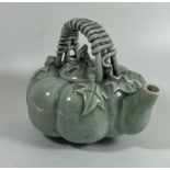 A CHINESE CELADON GLAZE TEAPOT WITH BRAIDED DESIGN HANDLE, HEIGHT 11 CM