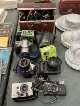 A COLLECTION OF VINTAGE CAMERAS TO INCLUDE A PRAKTICA L, OLYMPUS, CANON EOS 300, CANON EOS 650,