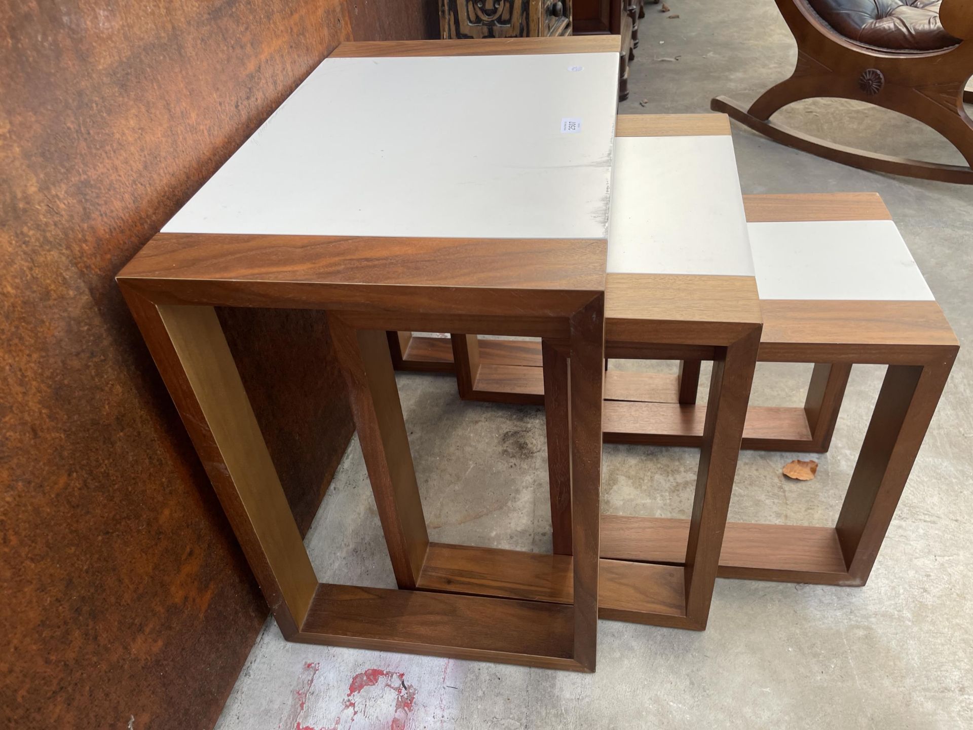 A RETRO TEAK AND MELAMINE NEST OF THREE TABLES - Image 3 of 3