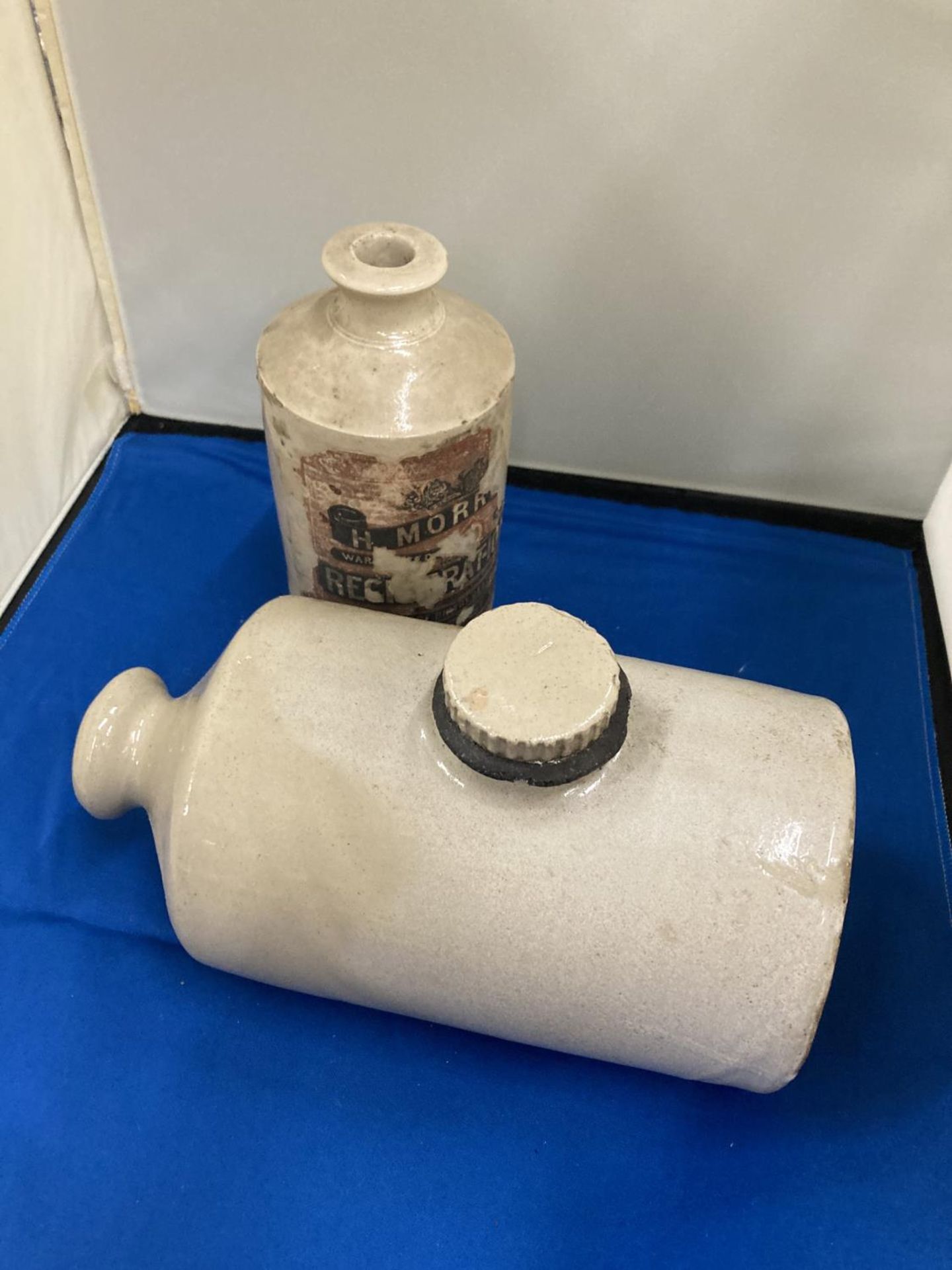 AN ANTIQUE STONEWARE LARGE INK BOTTLE TOGETHER WITH A STONE BED WARMER