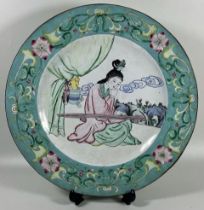 A VINTAGE CHINESE 20TH CENTURY ENAMEL ON COPPER DISH DEPICTING A GIRL, DIAMETER 28CM
