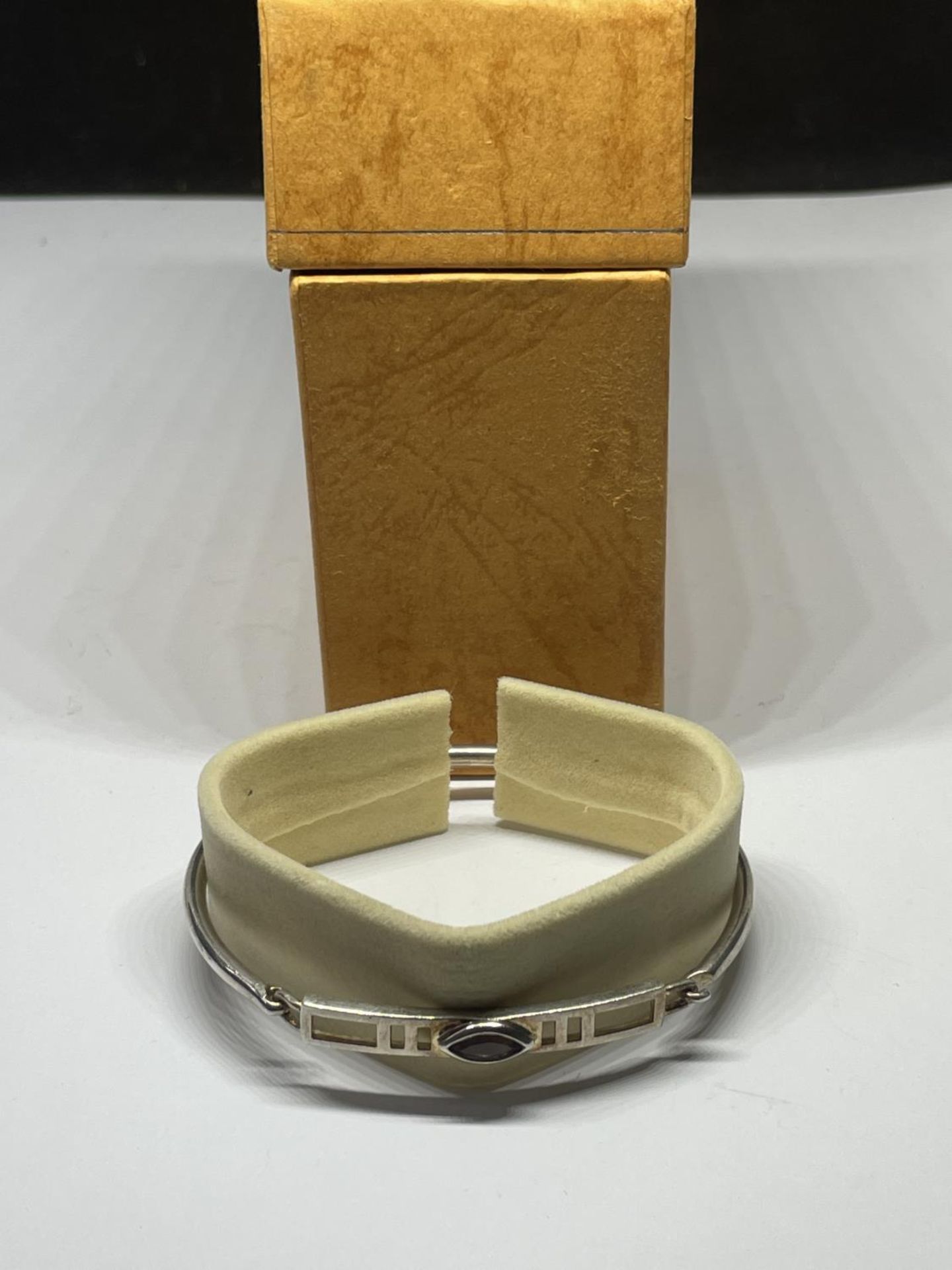 A SILVER MACINTOSH BANGLE, BOXED