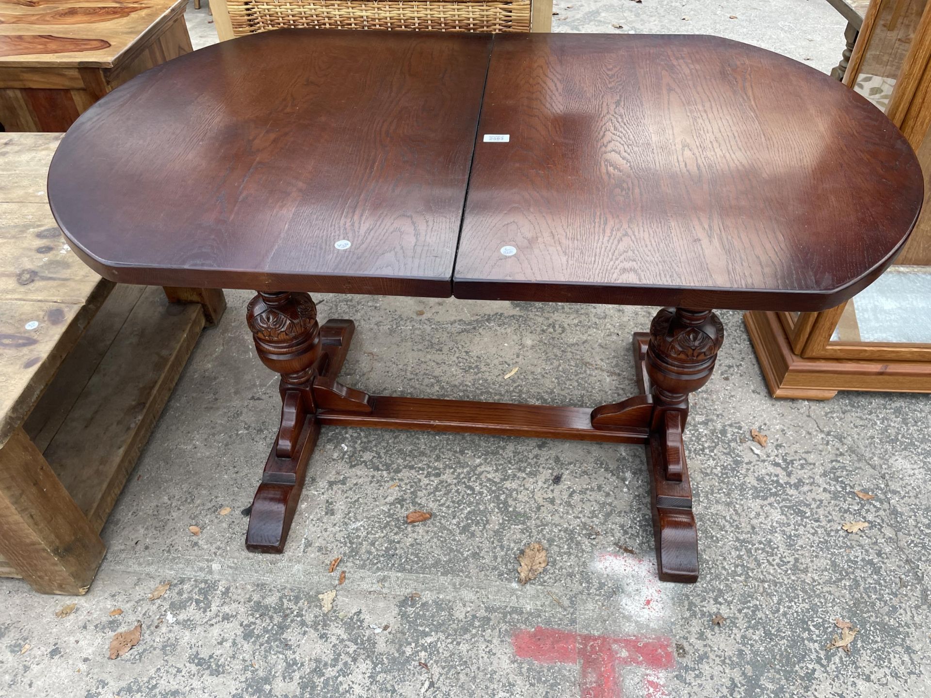 AN OAK EXTENDING PEDESTAL DINING TABLE, 50 X 32" (LEAF 15")