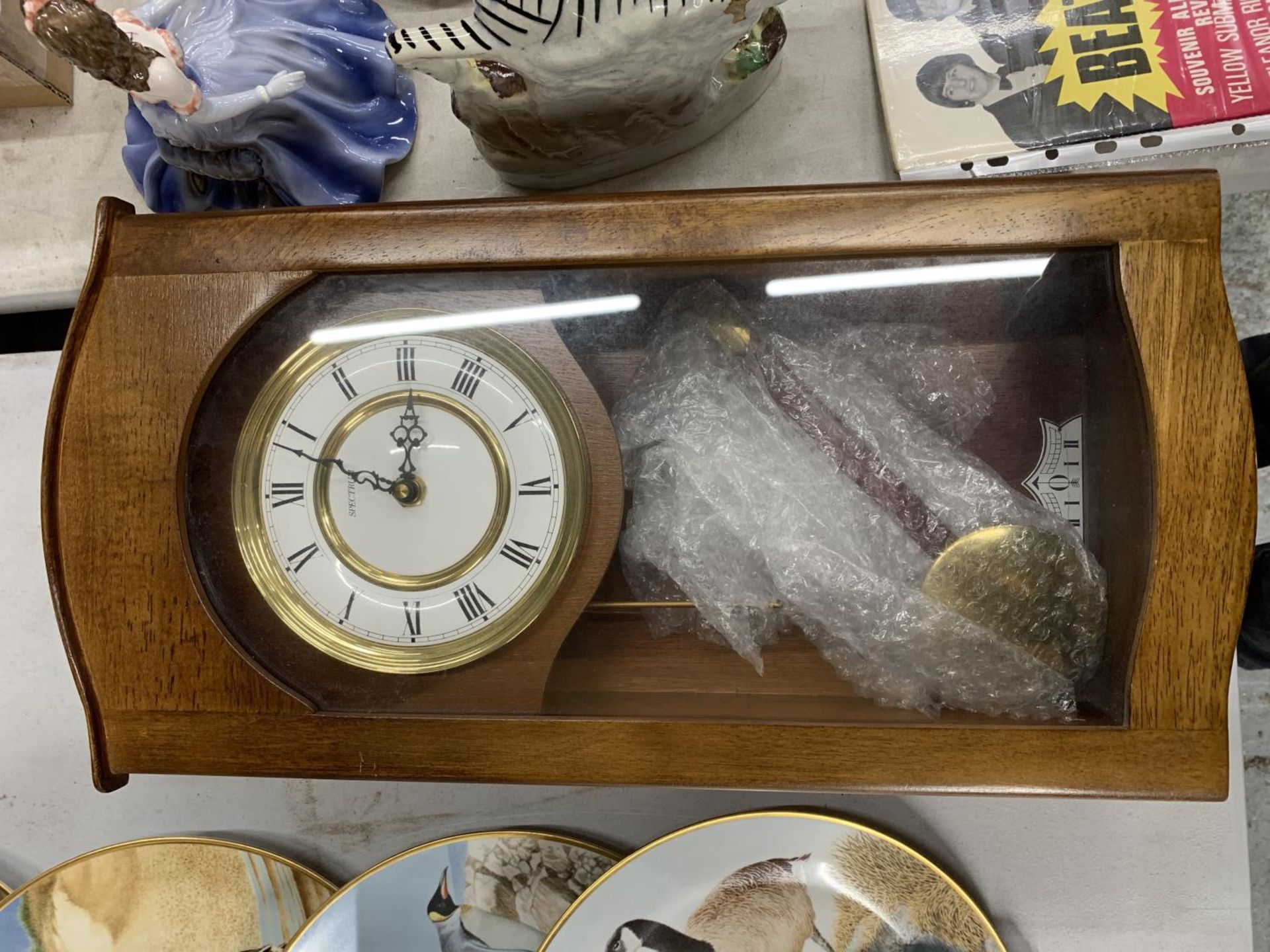 A CASED SPECTRUM WALL CLOCK