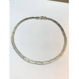 A HEAVY SILVER NECK CHAIN