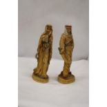 TWO VERY HEAVY SHEIKH AND ARAB LADY FIGURES, HEIGHT 31CM