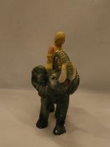 A VINTAGE CHALK FIGURE OF A BOY ON AN ELEPHANT, HEIGHT 30CM, LENGTH APPROX 24CM