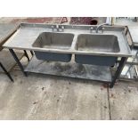 AN INDUSTRIAL STAINLESS STEEL DOUBLE SINK UNIT