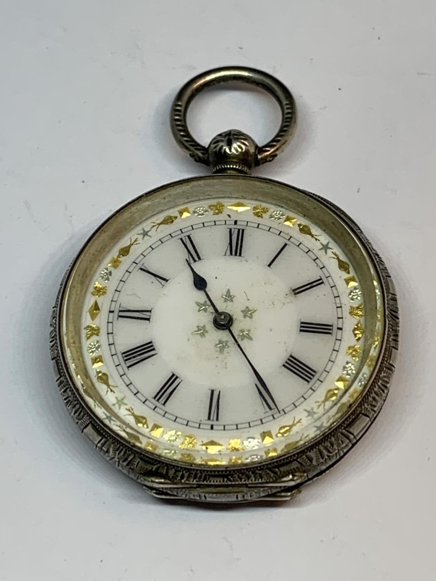 A MARKED 935 SILVER FOB WATCH WITH DECORATIVE ENAMEL FACE