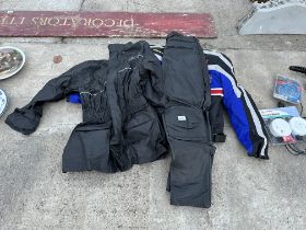 AN ASSORTMENT OF MOTORBIKE CLOTHING TO INCLUDE JACKETS AND LEATHER TROUSERS ETC