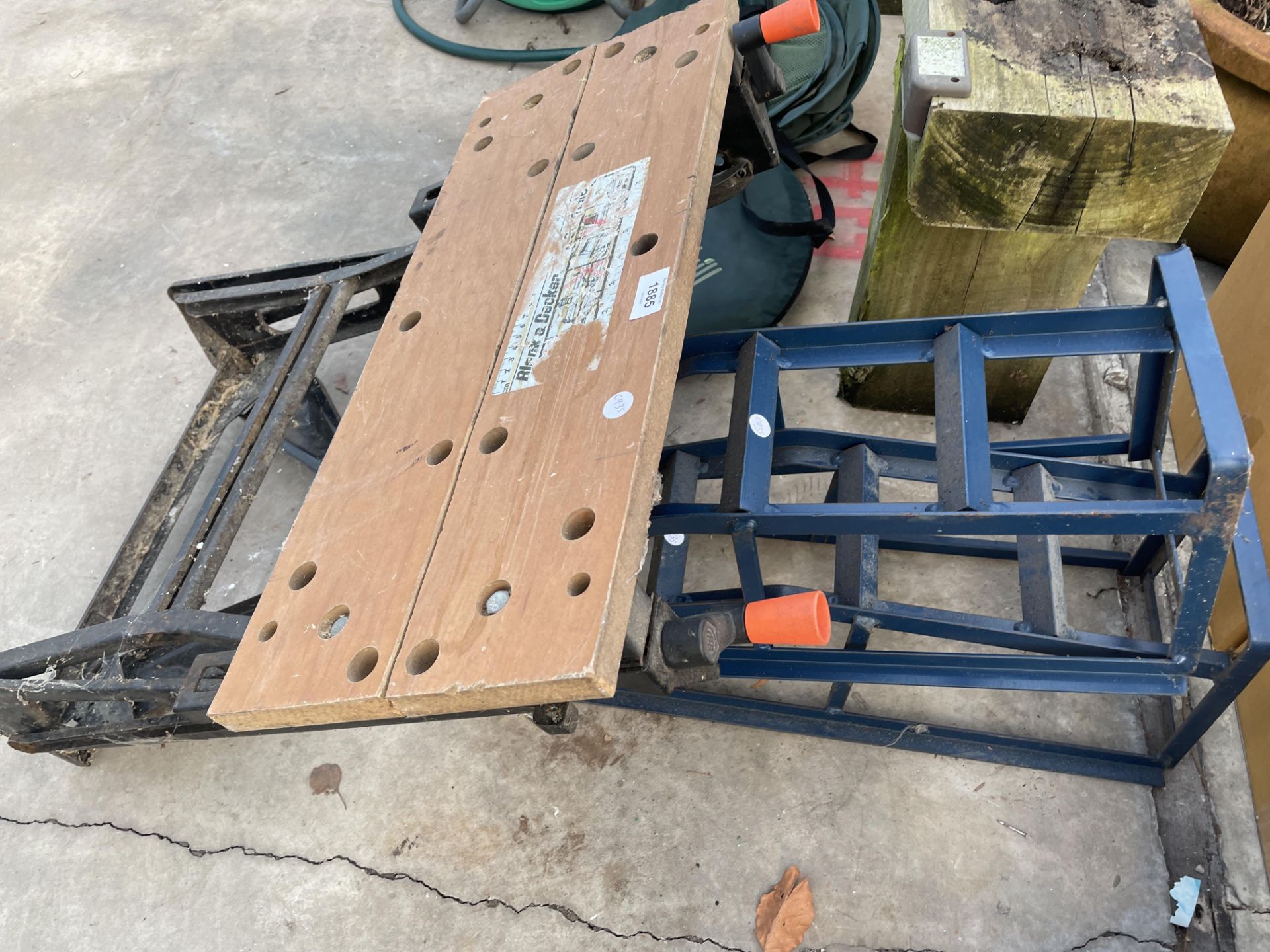 A BLACK AND DECKER FOLDING WORK MATE AND A PAIR OF METAL CAR RAMPS