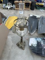 A VINTAGE BRASS OIL LAMP WITH GLASS FUNNEL