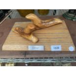 A PAIR OF ABSTRACT WOODEN CARVINGS ON A WOODEN PLINTH, TITLED 'INSIGHT'