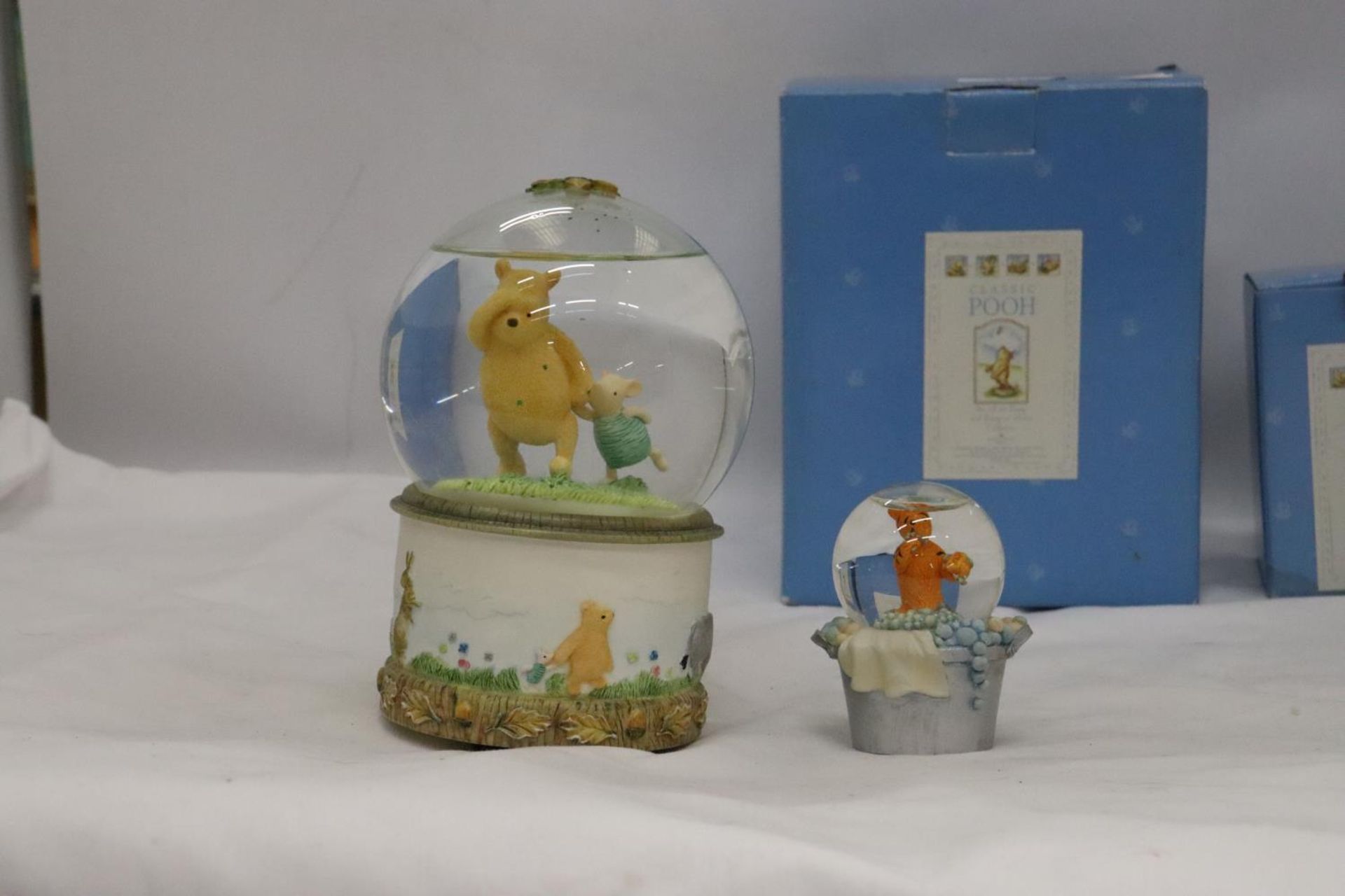 TWO BORDER FINE ARTS WINNIE THE POOH WATERBALLS, A LARGE WINNIE THE POOH AND PIGLET AND A SMALL