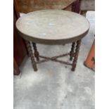 AN EMBOSSED BRASS 24" DIAMETER ISLAMIC TABLE ON FOLDING BARLEYTWIST BASE