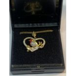 A NECKLACE WITH A CRYSTAL ROBIN PENDANT IN A PRESENTATION BOX