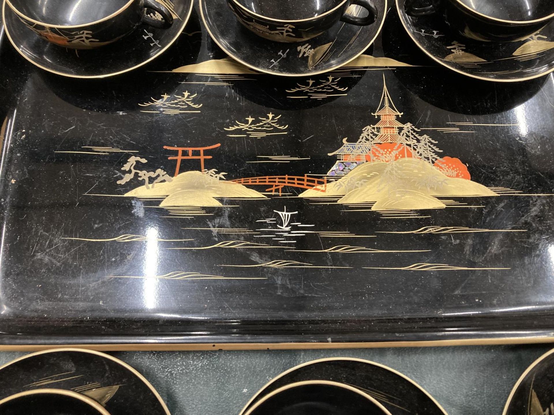 AN ORIENTAL HANDPAINTED, LACQUERED TRAY WITH SIX CUPS AND SAUCERS - Image 3 of 3