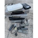 AN ASSORTMENT OF VHS PLAYERS WITH REMOTE CONTROLS TO INCLUDE PANASONIC ETC