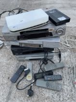 AN ASSORTMENT OF VHS PLAYERS WITH REMOTE CONTROLS TO INCLUDE PANASONIC ETC