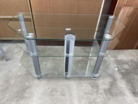 A MODERN GLASS THREE TIER TV STAND