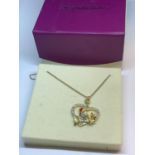 A NECKLACE WITH A CRYSTAL ROBIN PENDANT IN A PRESENTATION BOX