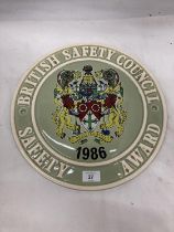 A LARGE CERAMIC PLAQUE 1986 BRITISH SAFETY COUNCIL SAFETY AWARD