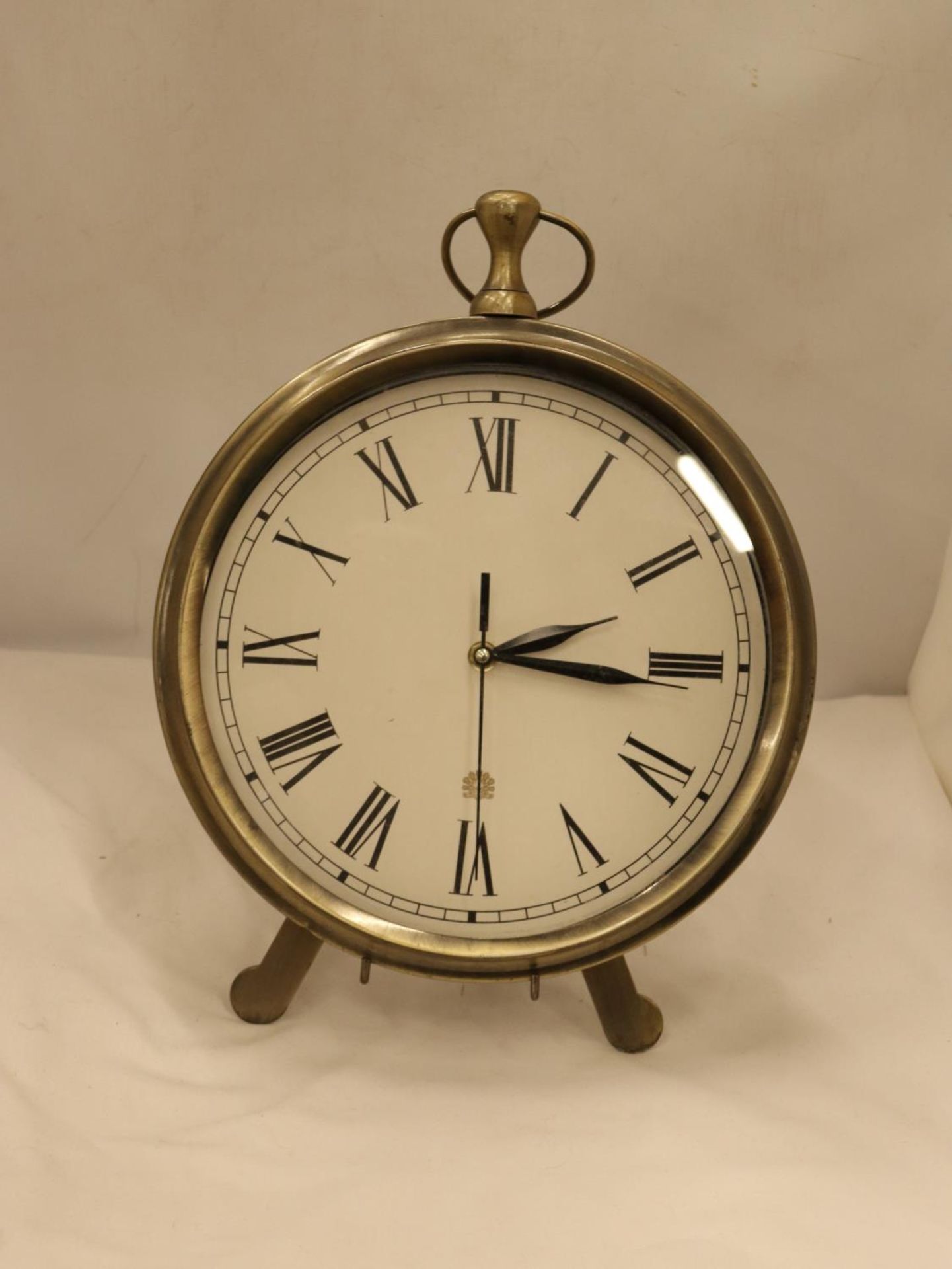 A LARGE POCKET WATCH CLOCK ON A STAND, HEIGHT 36CM