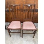 A PAIR OF EDWARDIAN MAHOGANY AND INLAID BEDROOM CHAIRS