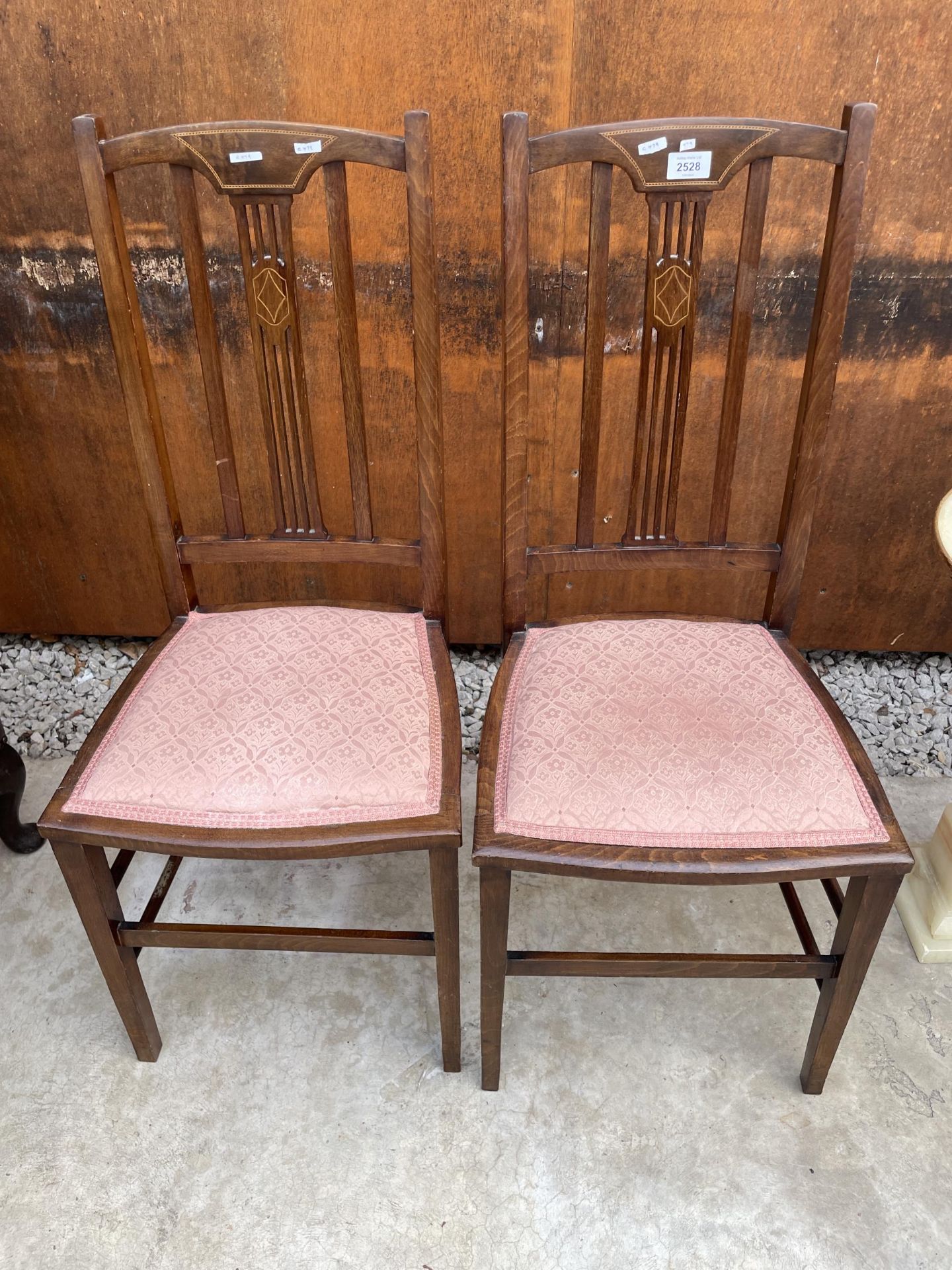 A PAIR OF EDWARDIAN MAHOGANY AND INLAID BEDROOM CHAIRS