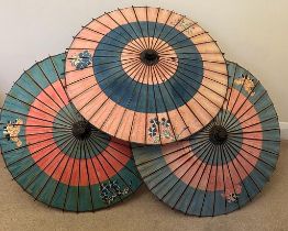 A GROUP OF THREE VINTAGE ORIENTAL FAN PARASOLS / UMBRELLAS