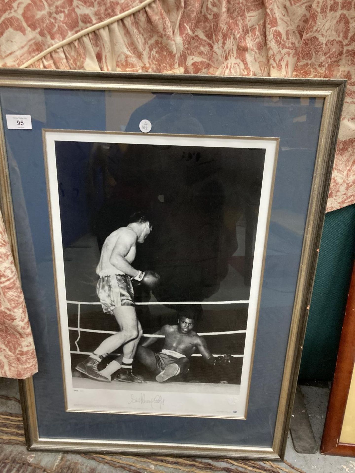 A SIGNED AND FRAMED MUHAMMED ALI & HENRY COOPER PHOTOGRAPH WITH CERTIFICATE OF AUTHENTICITY