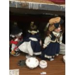 A GROUP OF ASSORTED DOLLS ON STANDS ETC