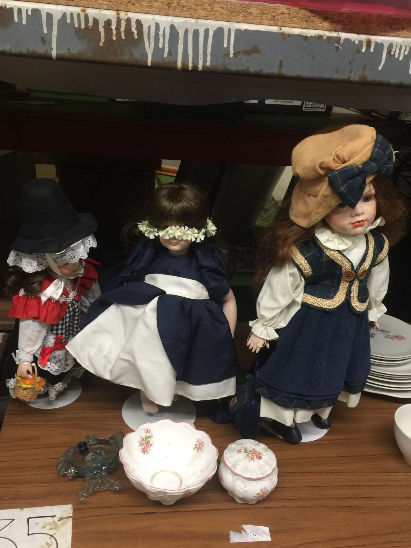 A GROUP OF ASSORTED DOLLS ON STANDS ETC