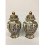 A PAIR OF LARGE CANTON FAMILLE ROSE TEMPLE JARS - APPROX 38 CM BOTH A/F