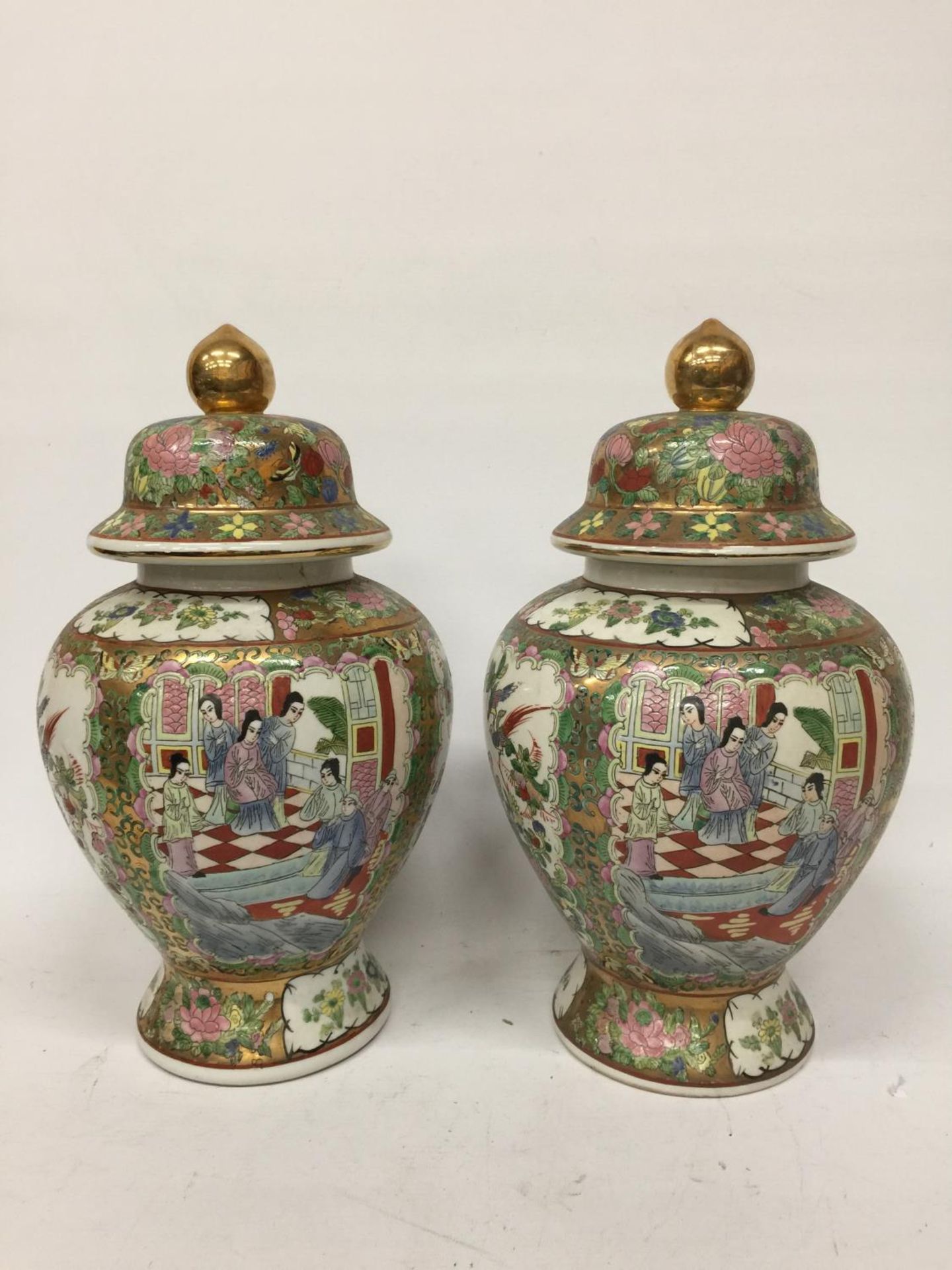 A PAIR OF LARGE CANTON FAMILLE ROSE TEMPLE JARS - APPROX 38 CM BOTH A/F
