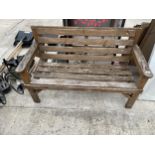 A TWO SEATER WOODEN GARDEN BENCH