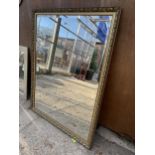 A GILT FRAMED WALL MIRROR WITH BEVEL EDGE, 54 X 40"