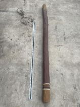 A DECORATIVE WOODEN DIDGERIDOO