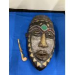 AN AFRICAN TRIBAL MASK, 29CM X 15CM PLUS A VINTAGE HANDMADE TRIBAL WOODEN PIPE