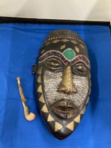 AN AFRICAN TRIBAL MASK, 29CM X 15CM PLUS A VINTAGE HANDMADE TRIBAL WOODEN PIPE