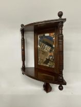 A MAHOGANY EDWARDIAN CORNER MIRROR WITH TWO COLUMS AND SHELF APPROX 18" TALL