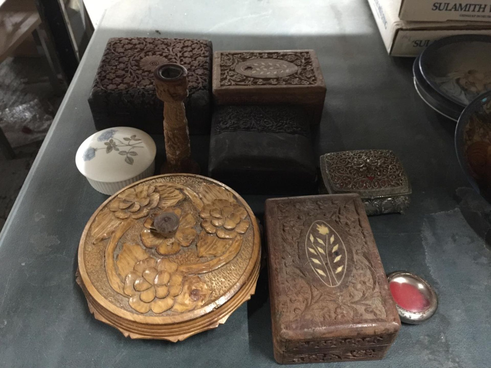 VARIOUS CARVED WOODEN BOXES AND CANDLESTICK