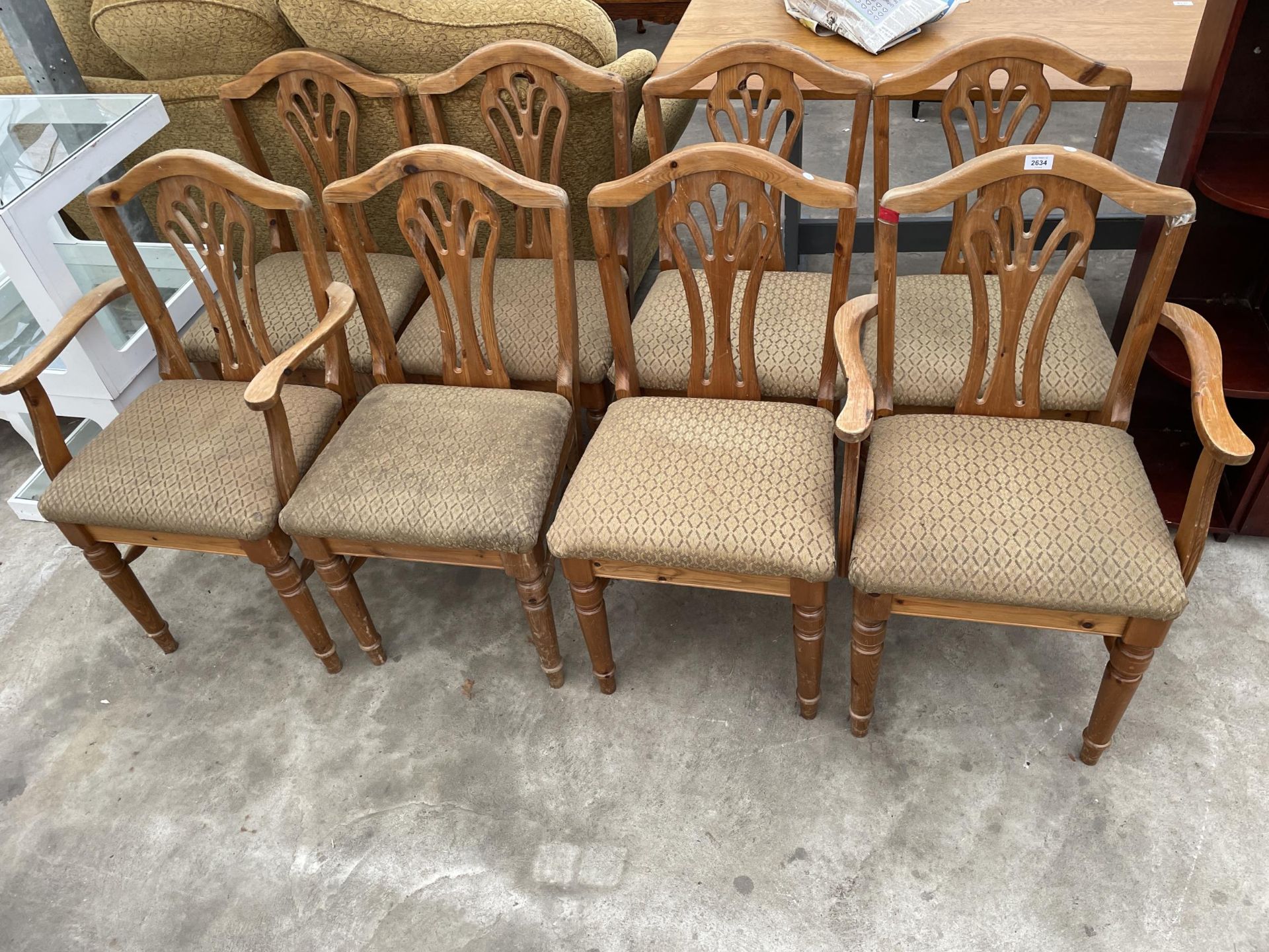 A SET OF EIGHT MODERN PINE DINING CHAIRS, TWO BEING CARVERS