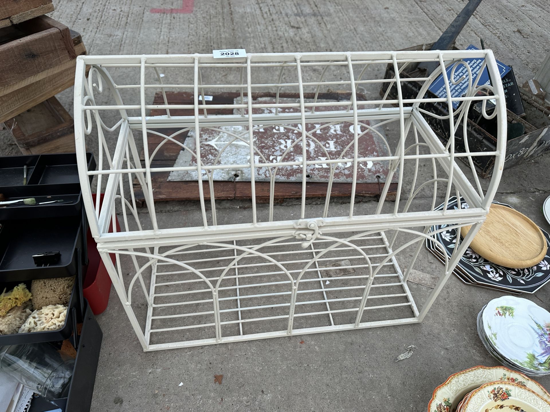 A METAL LIDDED STORAGE CRATE