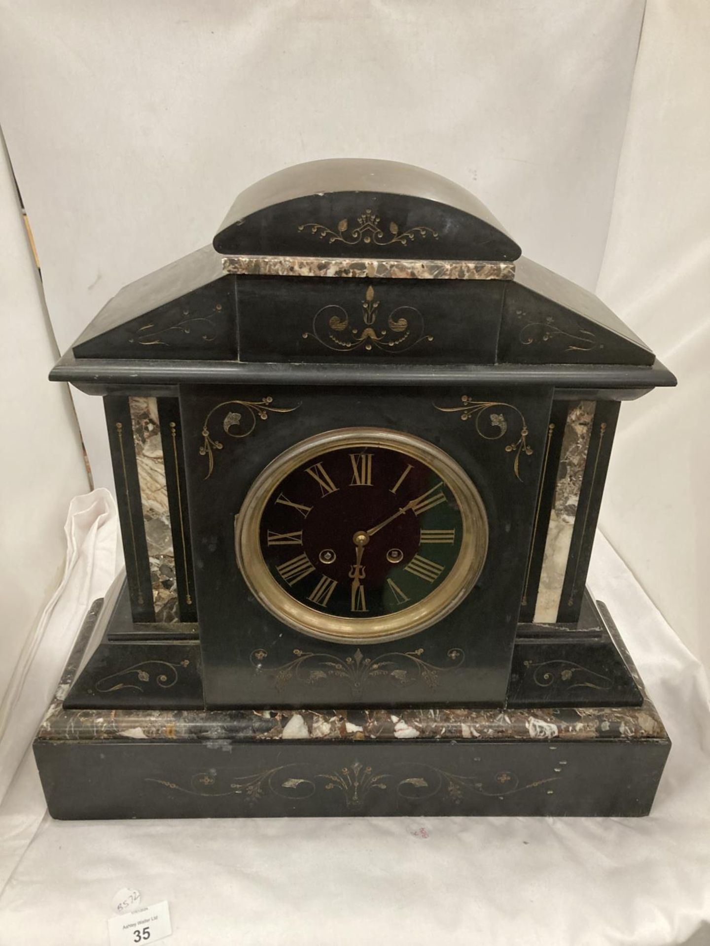 A LARGE DECORATIVE MARBLE AND SLATE MANTLE CLOCK
