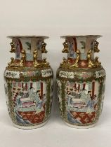 A LARGE PAIR OF CHINESE FAJMILLE ROSE VASES WITH LIZARD MOULDED NECK AND LION HANDLES