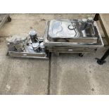 FOUR STAINLESS STEEL WARMING TRAYS AND STANDS