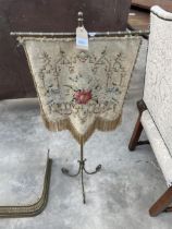 A VICTORIAN BRASS POLE SCREEN WITH TAPESTRY HANGING